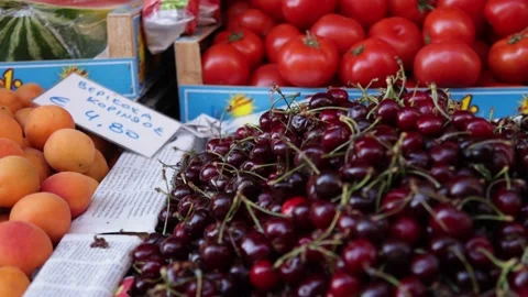Vegetable and fruit market on the street of a farmers market with fresh goods  Stock Footage 239446341