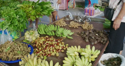 Vegetable and fruit sell in tradition market food with people hand grab Stock Footage 339263136