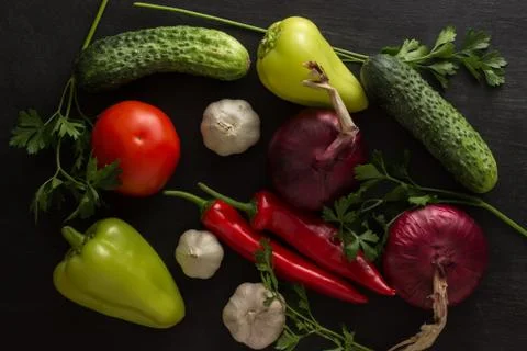Vegetable assortment of cucumbers, onion tomatoes with garlic and bitter and  Stock Photos
