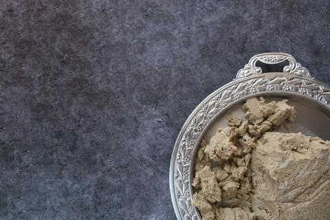 Vegetable-based halva sweet prepared from seeds on wooden background, close up Stock Photos