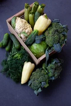 Vegetable basket. Fresh vegetables on the table black background. Set of food Foto stock