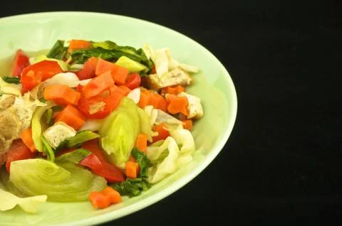 Vegetable boiled on black background Stock Photos