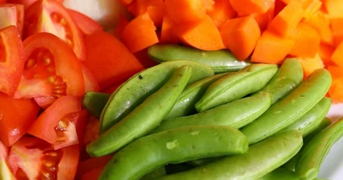 Vegetable carrot, tomato and string bean sliced on dish prepare cooking food Stock Footage 86001750