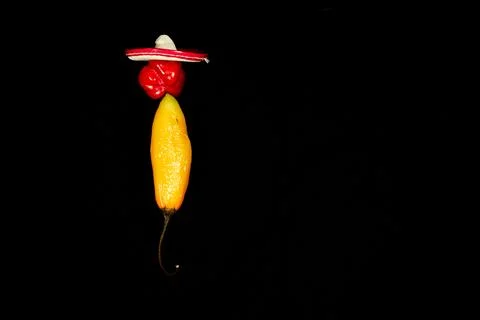 Vegetable chilli, chile face on black backgroung Stock Photos