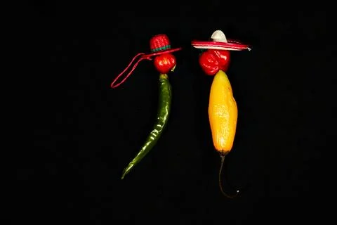 Vegetable chilli, chile face lovers on black backgroung Stock Photos