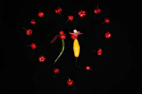 Vegetable chilli, chile face lovers on black backgroung Stock Photos