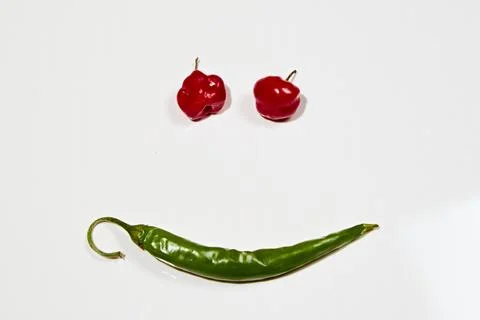Vegetable chilli, chile face on white backgroung Stock Photos