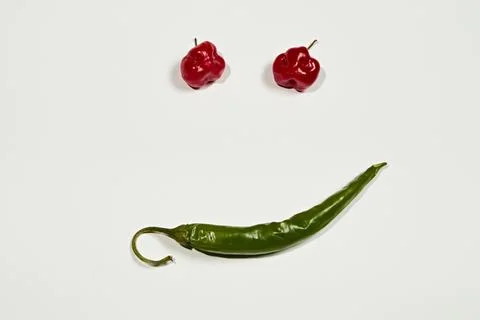 Vegetable chilli, chile face on white backgroung Stock Photos