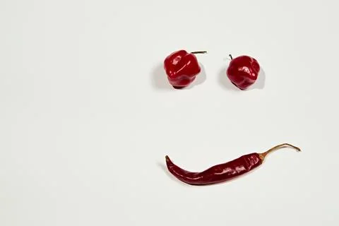 Vegetable chilli, chile face on white backgroung Stock Photos