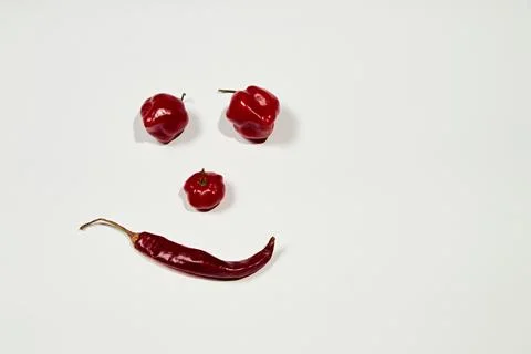 Vegetable chilli, chile face on white backgroung Stock Photos