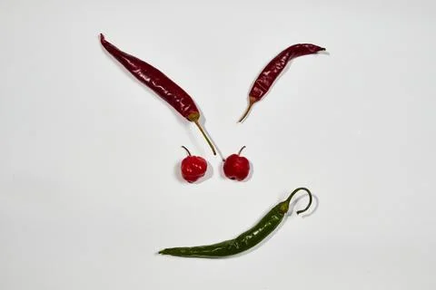Vegetable chilli, chile face on white backgroung Stock Photos