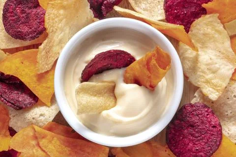 Vegetable chips with a dip close-up shot, top view Stock Photos