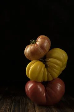 Vegetable composition with ripe bright tomatoes. Balancing creative concept. low Stock-Fotos