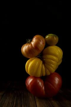 Vegetable composition with ripe bright tomatoes. Balancing creative concept. low Stock Photos