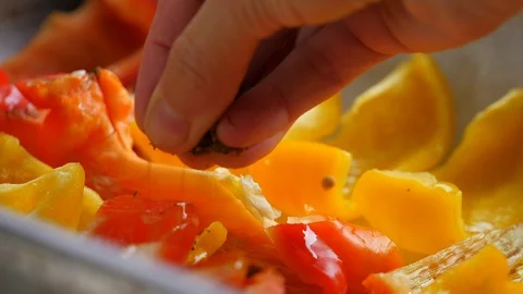 Vegetable cooking, preparation of yellow and red peppers Stock Footage 118973151