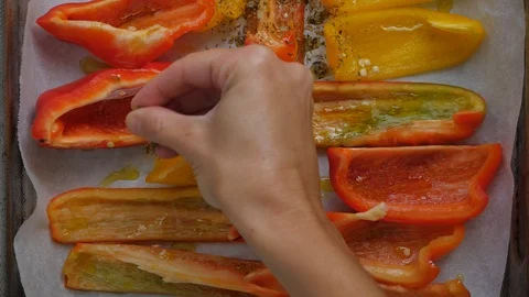 Vegetable cooking, preparation of yellow and red peppers Stock Footage 118973152