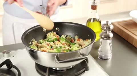 Vegetable couscous being seasoned Stock Footage 24672896