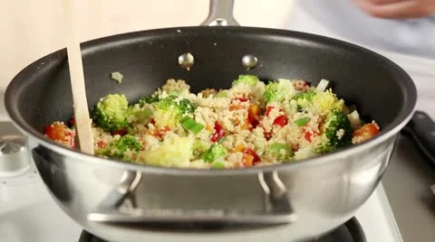 Vegetable couscous being sprinkled with parsley Video stock 24672951