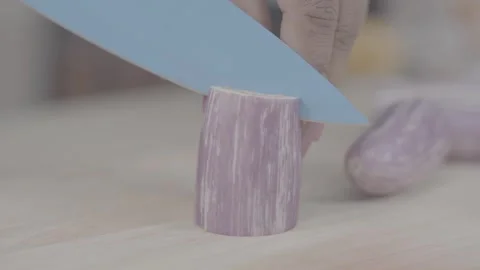 Vegetable Cut the eggplant in two Stock Footage 243120818