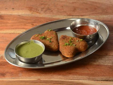 Vegetable cutlet, a delectable combination of mashed potatoes and vegetables. Stock Photos
