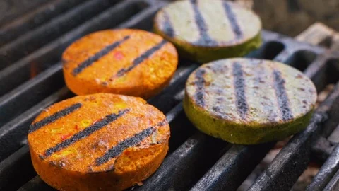 Vegetable cutlets for Vegan Burger cooking on the grill on fire 動画素材 108350799
