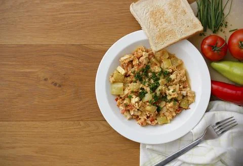 Vegetable dish called lecho containing peppers, tomatoes, eggs and tomatoes Stock Photos