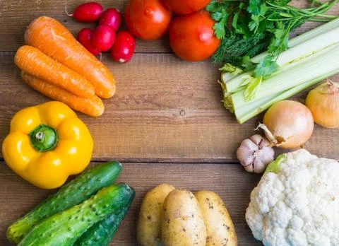 Vegetable frame on wooden background Stock Photos