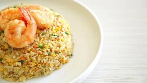 Vegetable fried rice served with shrimp on a white plate Stock Photos