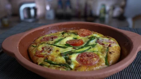 Vegetable frittata with egg, tomato, pepper, onion, cheese and green wild garlic Stock Footage 172640976