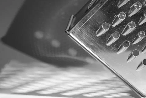 Vegetable grater, close up of kitchen tool, black and white Stock Photos