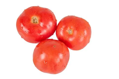 Vegetable isolate. Three red tomatoes on a white background. Stock Photos