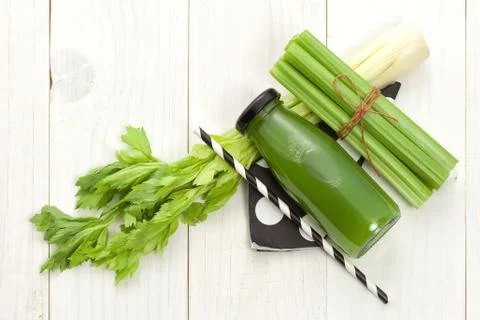 Vegetable juice in bottle with celery Stock Photos