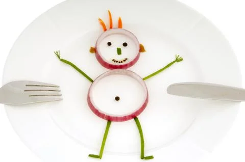 Vegetable man on dish Stock Photos