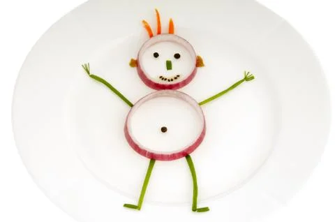 Vegetable man on dish Stock Photos