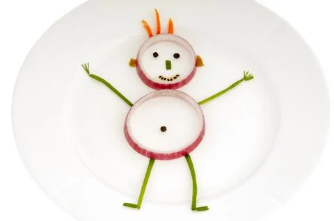 Vegetable man on dish Stock Photos