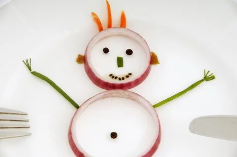 Vegetable man on dish Stock Photos