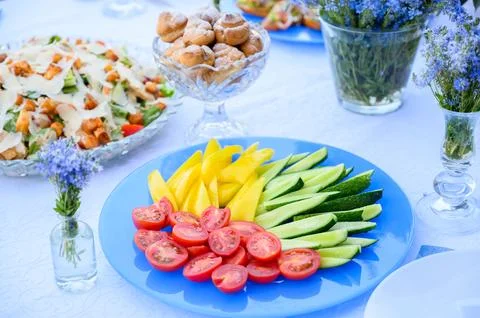 Vegetable, meat, fruit snacks on the table Stock Photos