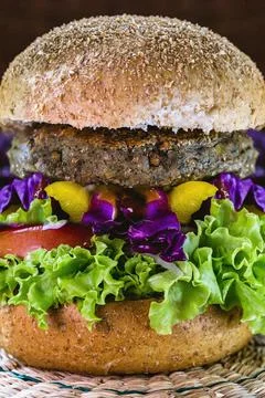 Vegetable meat, meatless hamburger, bread without eggs or milk, 100% vegan fo Stock Photos