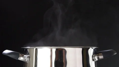 The vegetable mix is covered in a saucepan. Vegetables are cooked for lunch. Stock-Footage 89841329