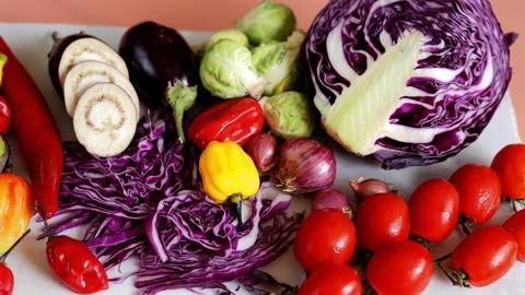 Vegetable mix featuring Brussels sprouts, mushrooms, red onions, and vibrant Stock Photos