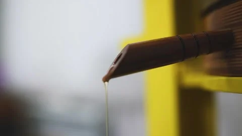 The vegetable oil flows out of the tap of the cold press Stock Footage 146522422