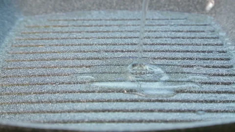 Vegetable oil is poured into the pan Stock Footage 121018029