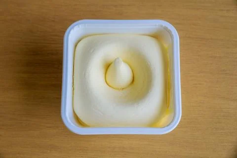Vegetable oil spread in a plastic container. Stock Photos