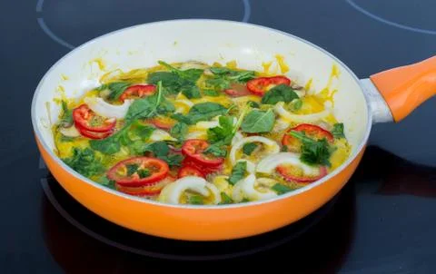 Vegetable omelette in pan Stock Photos