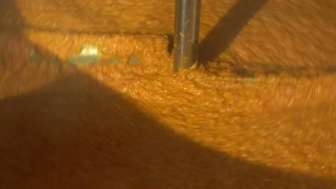 Vegetable paste in automated production line. Factory machine  mixes paste. Video stock 132986590