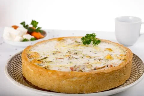 Vegetable pie on a plate, white background, studio photo Stock Photos