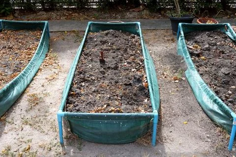 Vegetable plot in green frame on land. Stock Photos