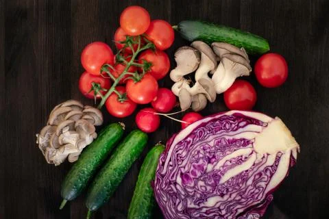 Vegetable in reusable bags on wood background, top view Stock Photos