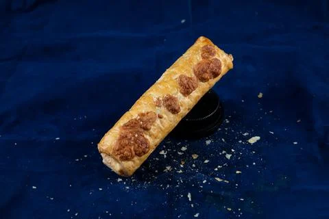 Vegetable roll isolated on blue background side view of savory snack food Stock Photos