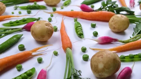 Vegetable rotating background of potatoes, peas, carrots and radishes Stock Footage 211734152
